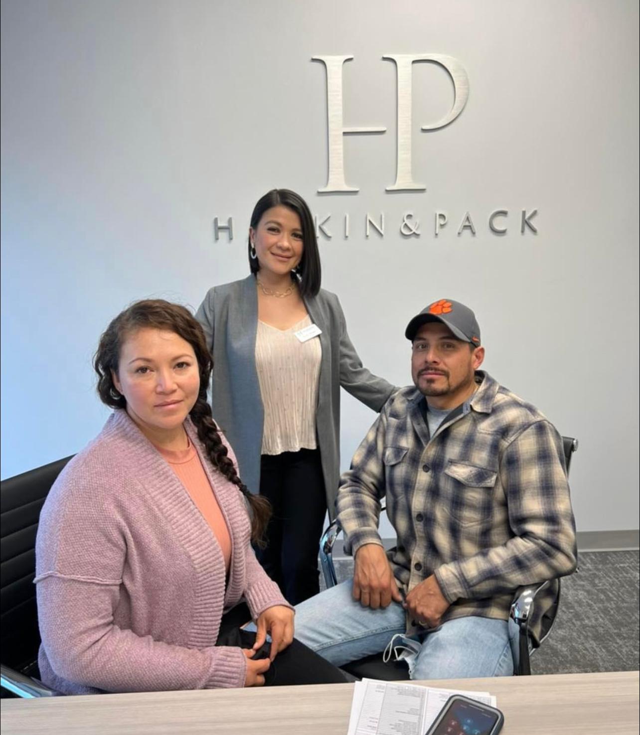 Sandy Alvear with clients at Hankin and Pack closing table