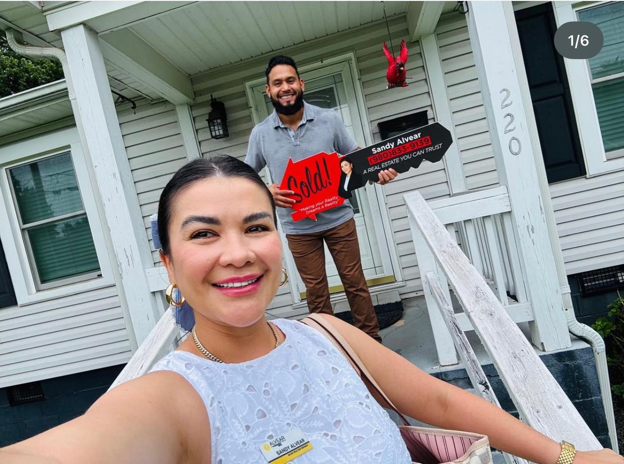 Sandy Alvear Realtor with client sold sign Belmont NC